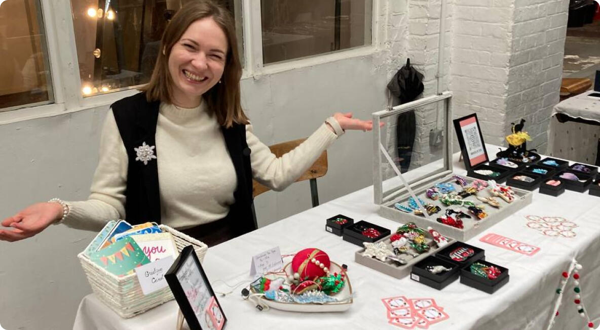 Olya and her brooches at the fair